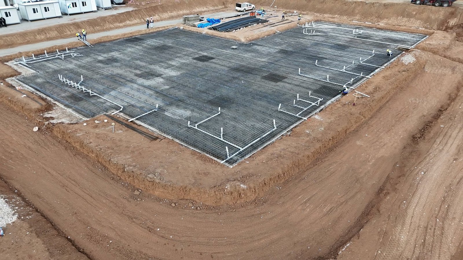 Aerial view of a reinforced foundation and embedded pipework